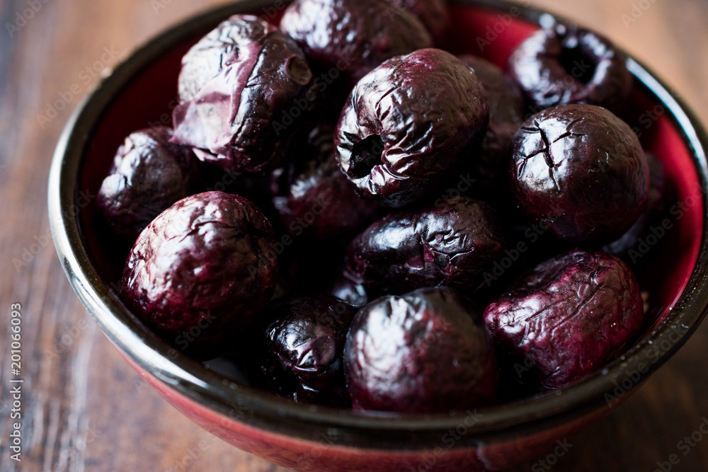 Dried Black Olive Chips / Crackers without seeds in Bowl. Dried Black Olive Chips / Crackers without seeds in Bowl.