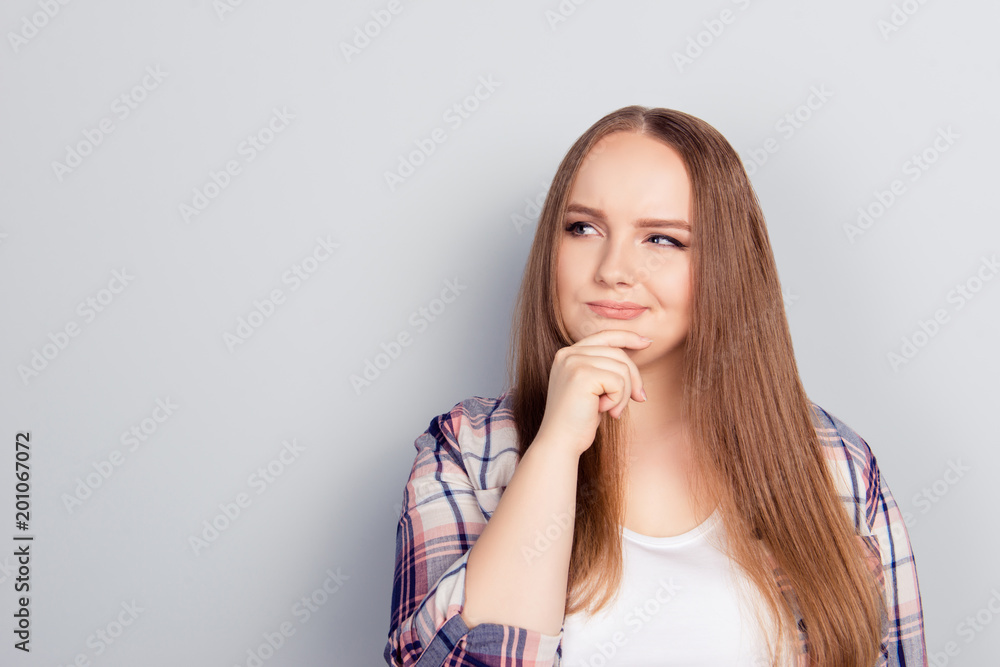 Young woman with her hand on her chin Young woman with her hand on her chin
