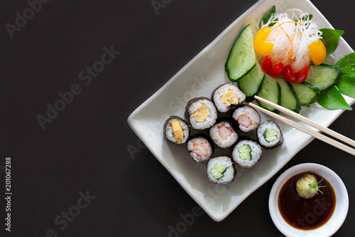 Sushi multiple stuffed Japanese food  on white dish with wasabi sauce