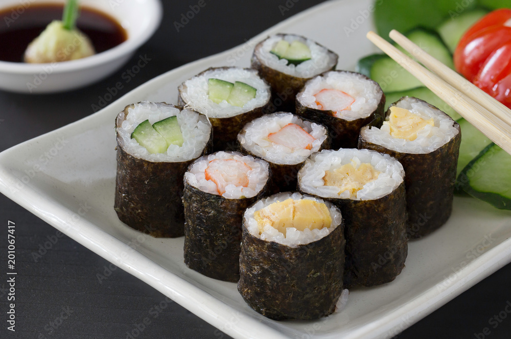 Sushi multiple stuffed Japanese food on white dish with wasabi sauce / Selective focus.. Sushi multiple stuffed Japanese food on white dish with wasabi sauce / Selective focus..