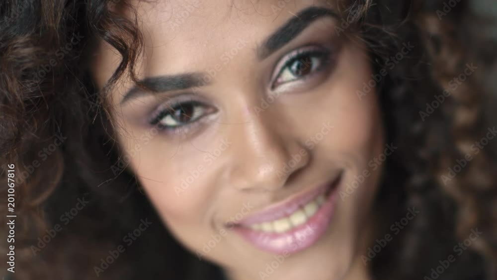 portrait of a girl with a beautiful make-up and curls portrait of a girl with a beautiful make-up and curls