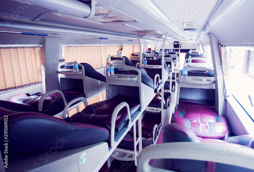 interior of sleeper bus for tourists and other passengers photo