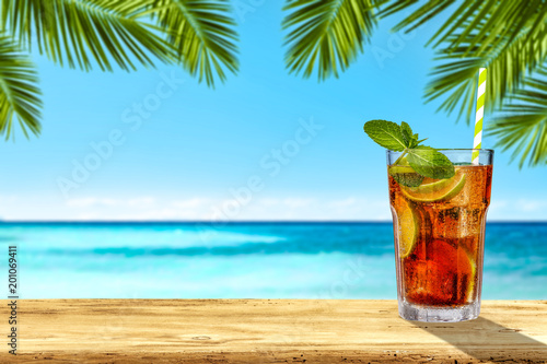 Summer drink on desk and sea landscape 