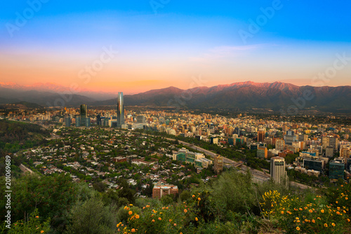 View of Santiago de Chile with Los Andes mountain Range in the back at sunset