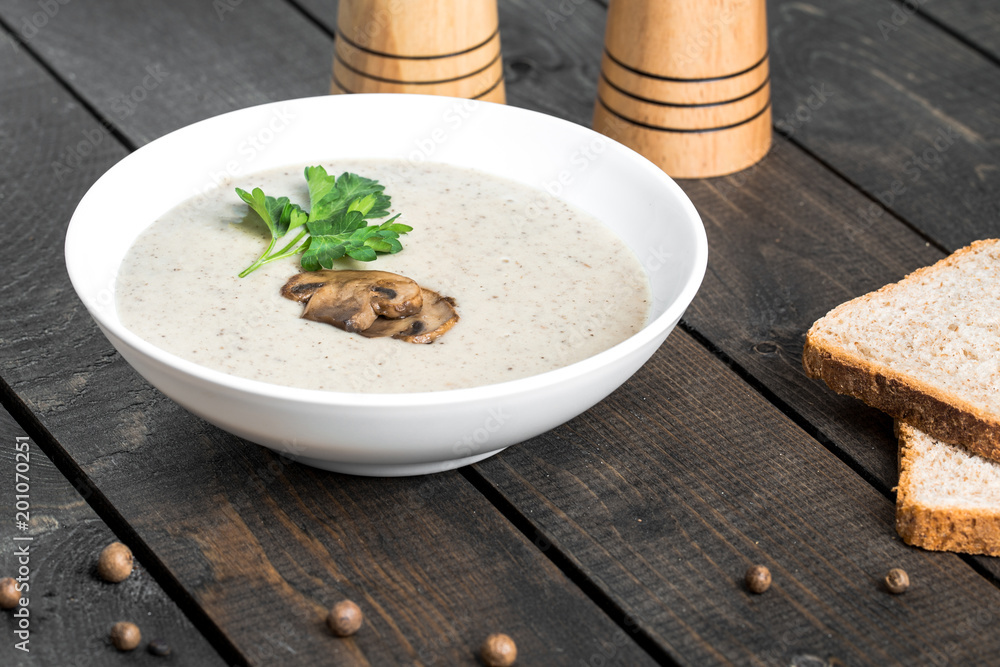 A bowl of mushroom soup cream on the table A bowl of mushroom soup cream on the table