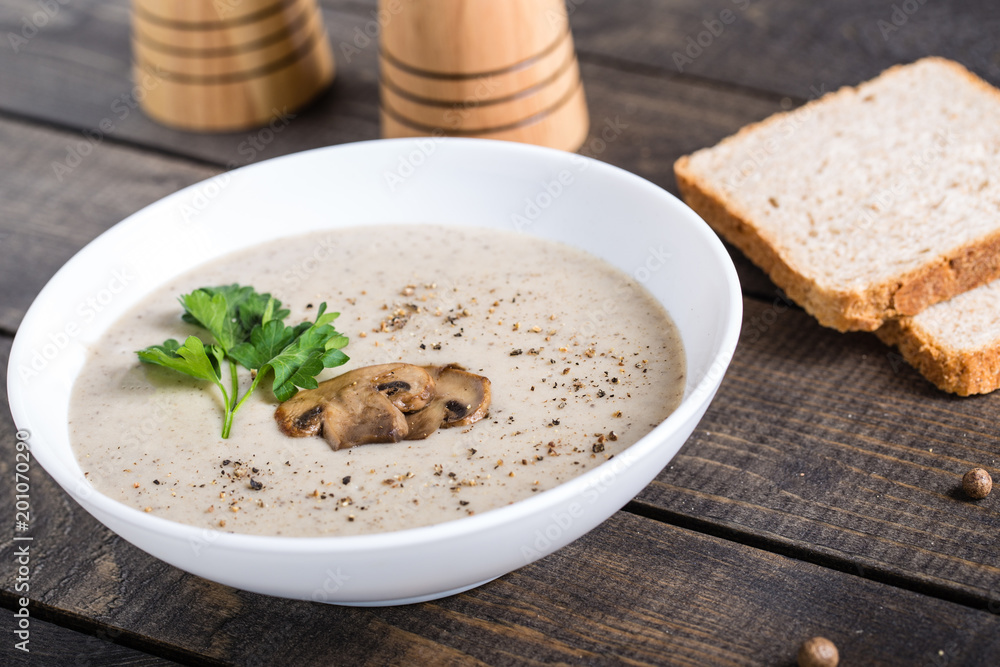 A bowl of mushroom soup cream on the table A bowl of mushroom soup cream on the table