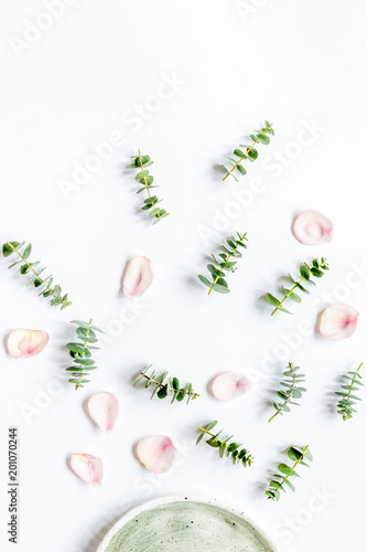 breakfast plate with petals and eucalyptus on white background t