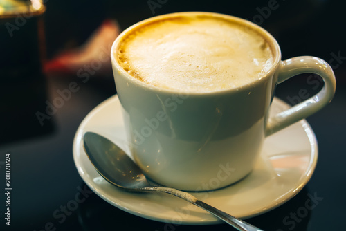 drinking hot coffee cappuccino in coffee shop 