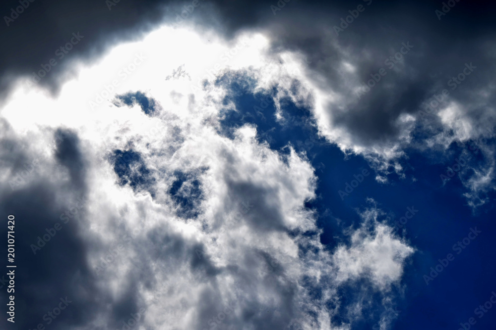 The blue sky dramatically turns into heavy black clouds. The blue sky dramatically turns into heavy black clouds.