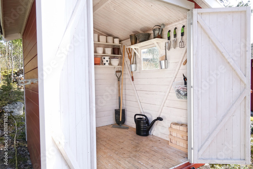 Fototapeta Storage shed filled with garden tools