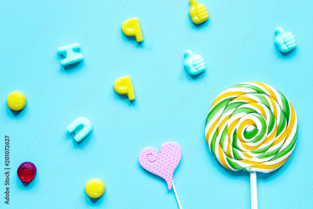 sweets and sugar candies on blue background top view pattern sweets and sugar candies on blue background top view pattern