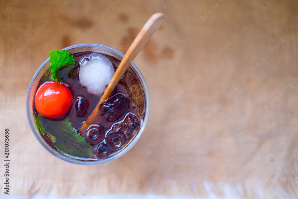 Fototapeta premium Cold drink with mint and ice in a glass
