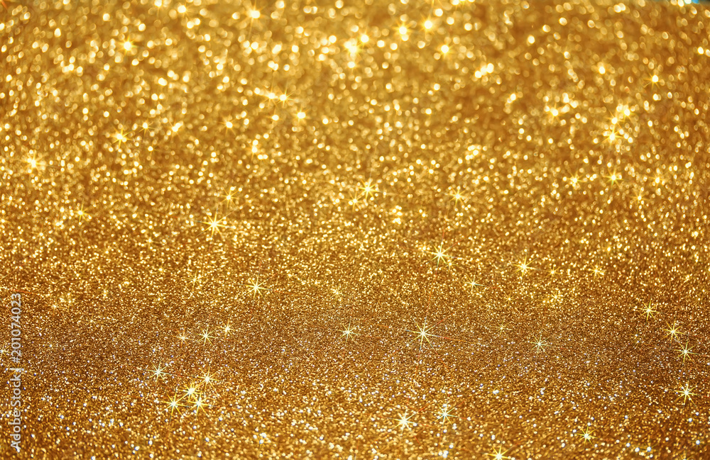 beautiful festive shiny Golden background of bright sparks and shimmering stars and specks beautiful festive shiny Golden background of bright sparks and shimmering stars and specks