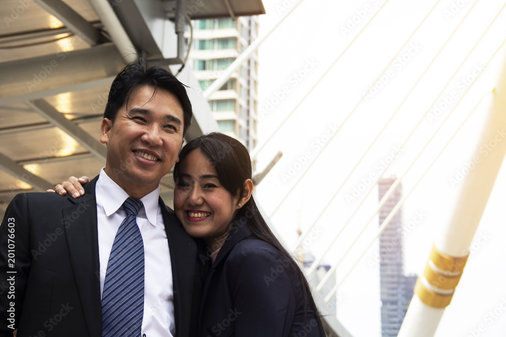 Beautiful Asia Business lover smiling and happy in business, building in the city. Beautiful Asia Business lover smiling and happy in business, building in the city.