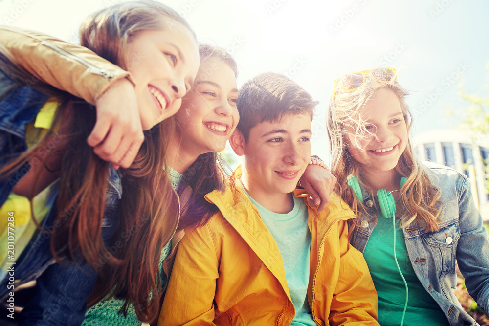 friendship and people concept - group of happy teenage students or friends outdoors