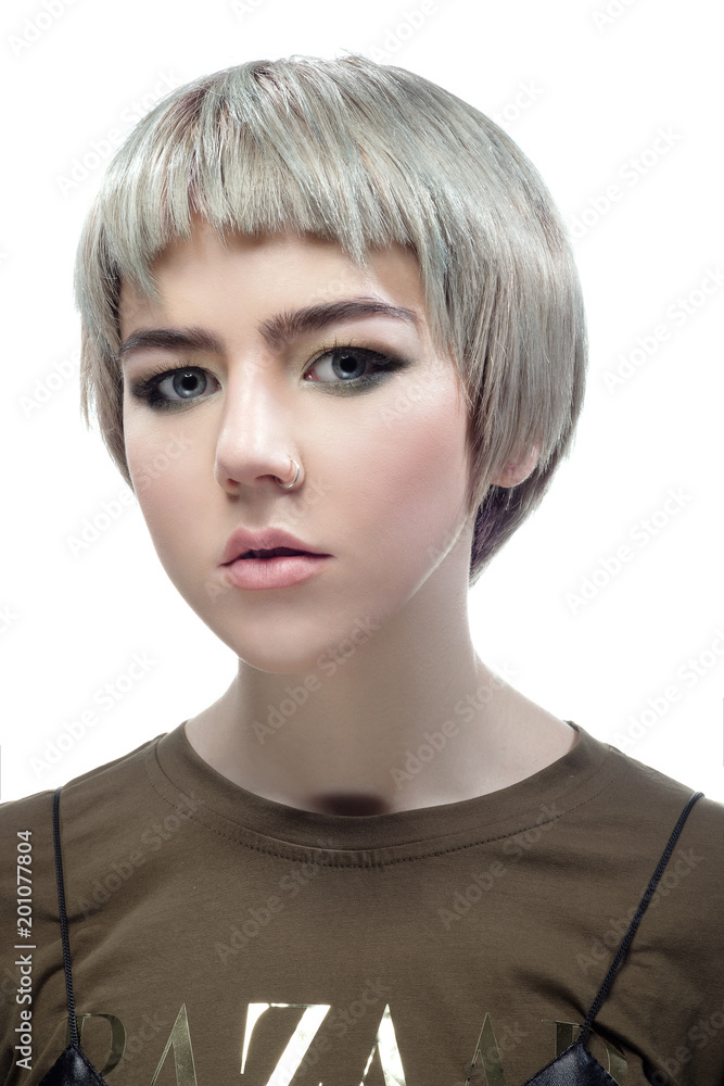 Beautiful young woman with short grey and green hair Beautiful young woman with short grey and green hair