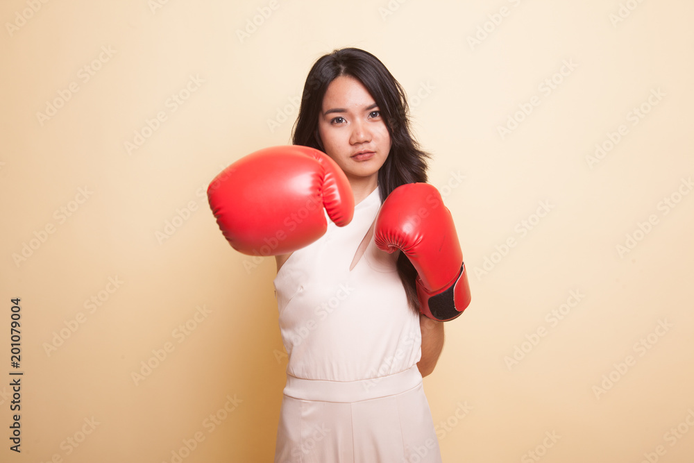 Young Asian woman with red boxing gloves. Young Asian woman with red boxing gloves.
