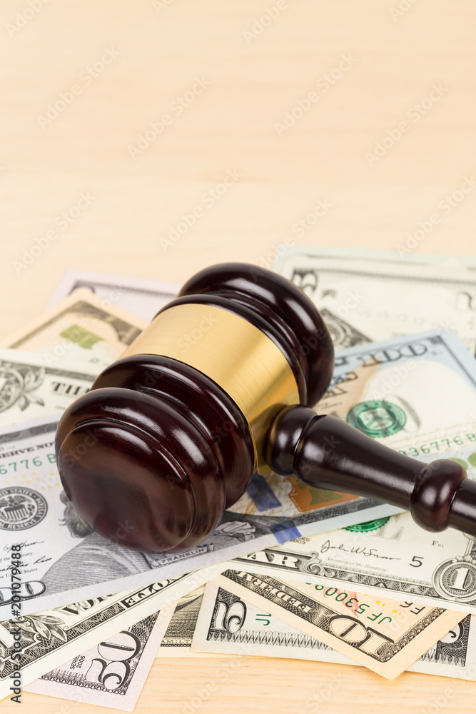 Judge wooden gavel with dollar money banknote concept for bribery