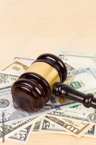 Judge wooden gavel with dollar money banknote concept for bribery