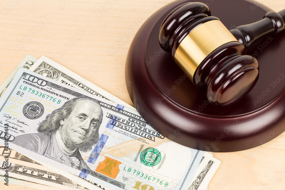 Judge wooden gavel with dollar money banknote concept for bribery