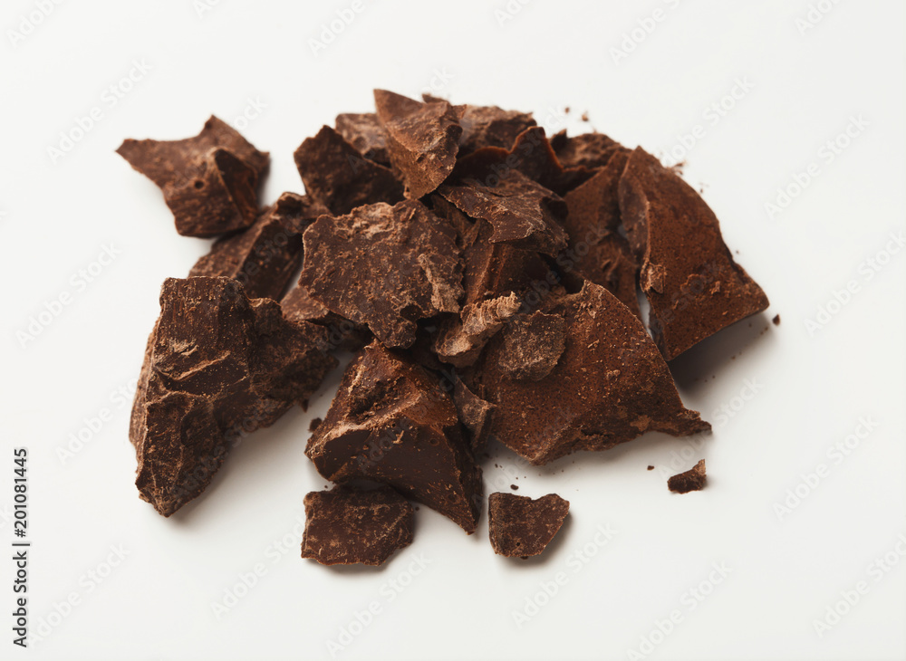 Heap of chocolate pieces isolated on white Heap of chocolate pieces isolated on white