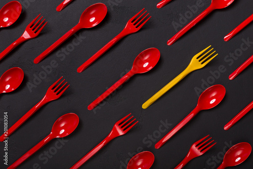 Top view on plastic forks on violet background