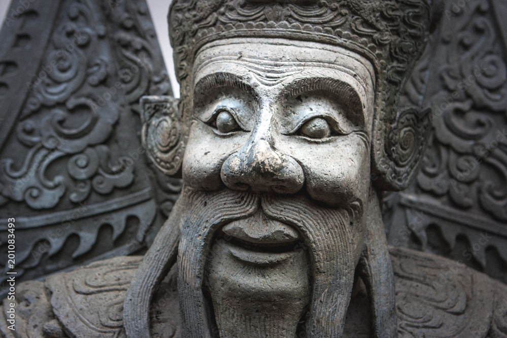 Chinese stone statue at the Wat Pho Temple, Bangkok, Thailand