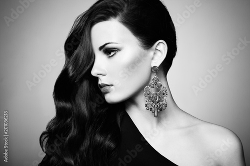 Portrait of beautiful brunette woman in black dress. Cosmetic Eyeshadows. Fashion photo