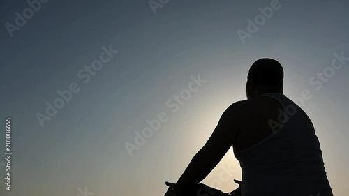 50n years old praying man silhouette camera distancing photo
