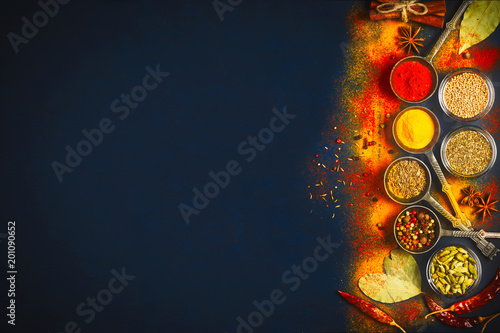 Fototapeta Naklejka Na Ścianę i Meble -  Wooden table of colorful spices