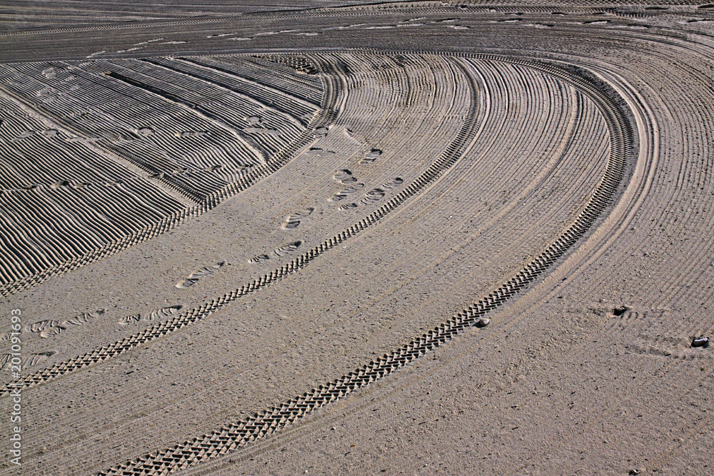 Traces of man on the sand on the Mediterranean Sea beach Traces of man on the sand on the Mediterranean Sea beach