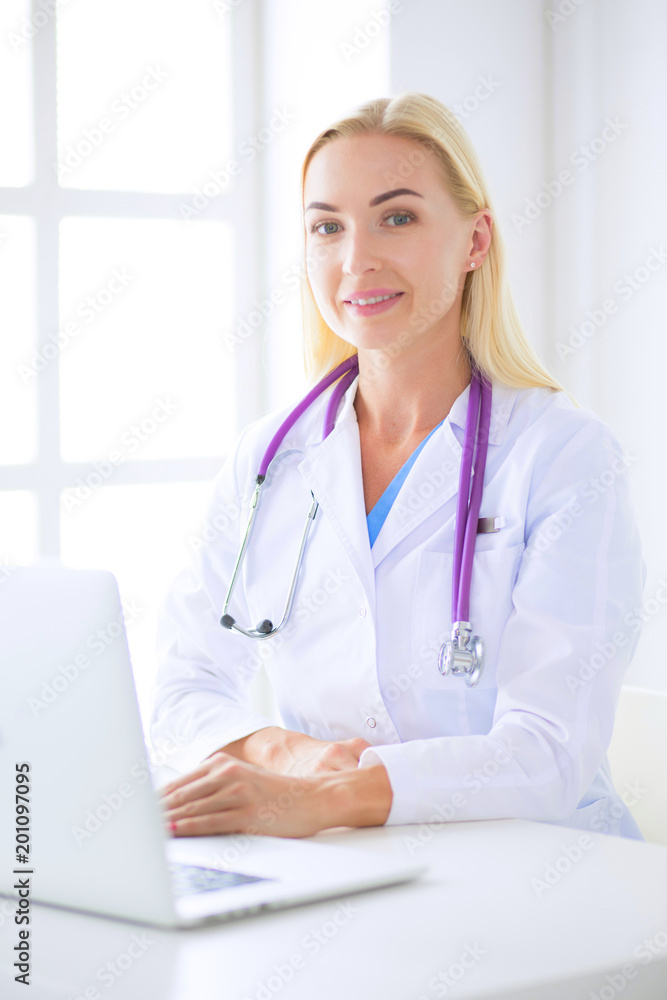 portrait of a young female doctor in a medical office portrait of a young female doctor in a medical office