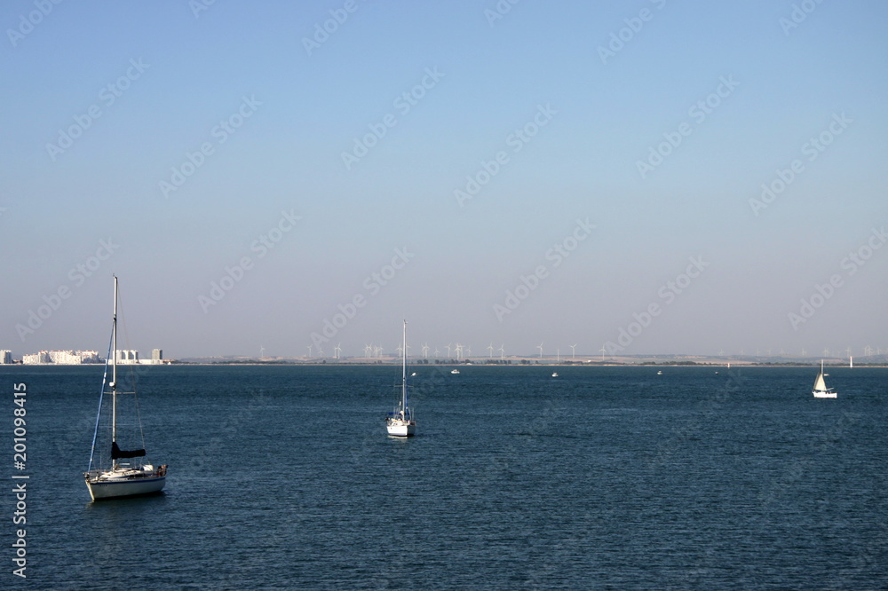 Sailing yachts in the harbor of the seaport of Cadiz on the coast of the Bay of Cadiz in the Atlantic Ocean. Sailing yachts in the harbor of the seaport of Cadiz on the coast of the Bay of Cadiz in the Atlantic Ocean.