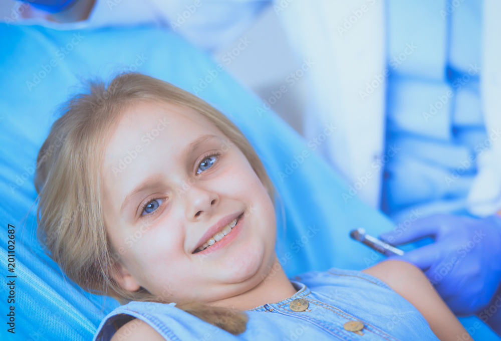 Little girl sitting in the dentists office. Little girl sitting in the dentists office.