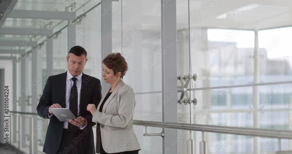 Business people having meeting in modern office using digital tablet Business people having meeting in modern office using digital tablet