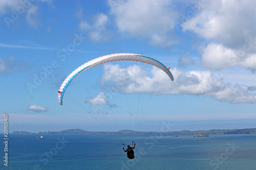 Paraglider flyingabove Newgale Bay