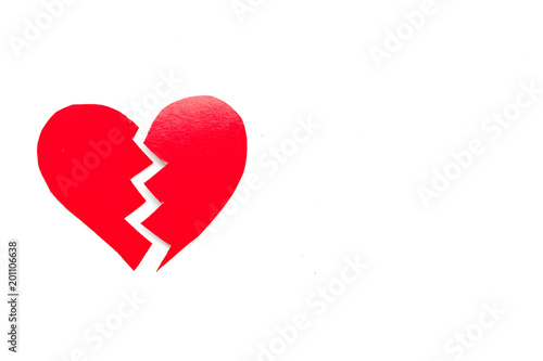 Divorce concept. Sign of divorce. Broken paper heart on white background top view copy space