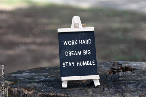 Inspirational quote - Work hard, dream big, stay humble, on black board.