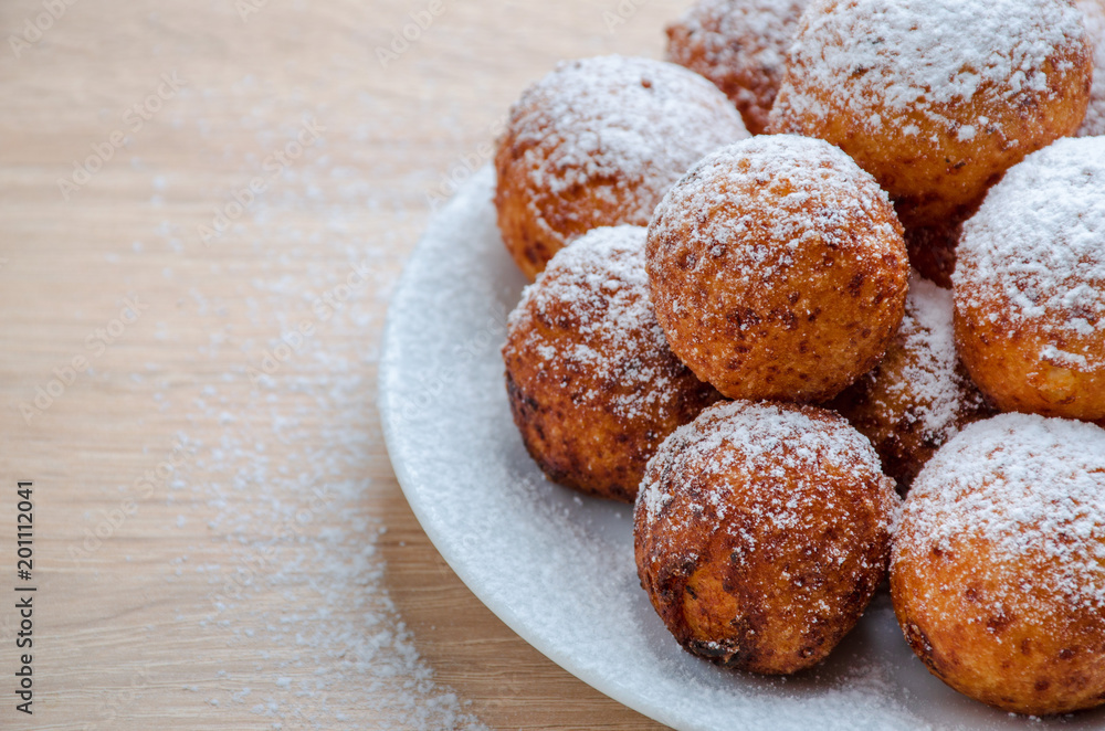 Fototapeta premium Curd cheese doughnuts on wooden background