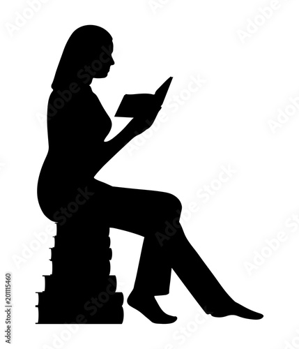 Silhouette of a woman sitting on a pyramid of books