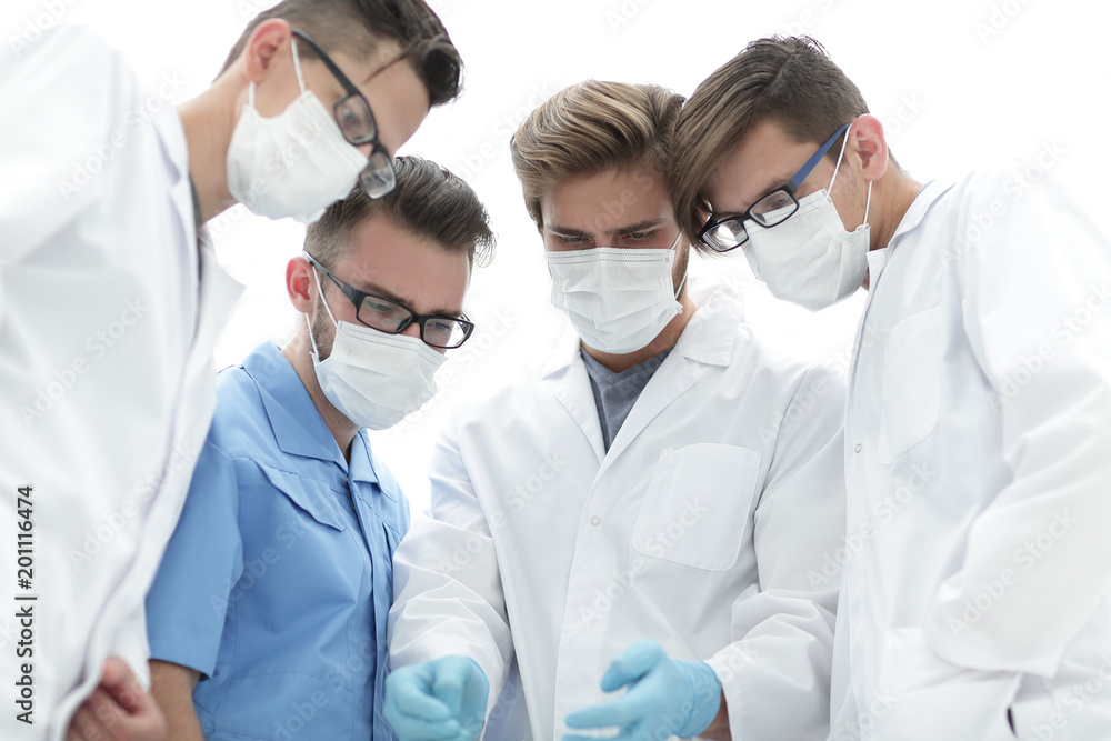 closeup. a team of doctors in protective masks. closeup. a team of doctors in protective masks.