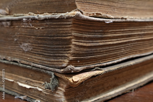 An old, dilapidated yellowed book. Sheets of an old book. Macro