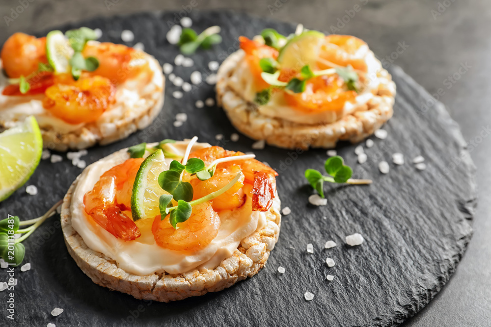 Delicious small sandwiches with shrimps on slate plate Delicious small sandwiches with shrimps on slate plate