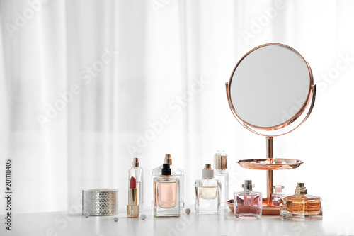 Valokuvatapetti Perfume bottles on dressing table