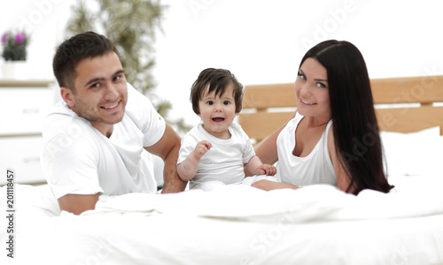 A young family with young children to bed in the bedroom