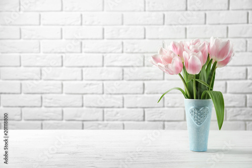 Vase with beautiful tulips for Mother's Day on table