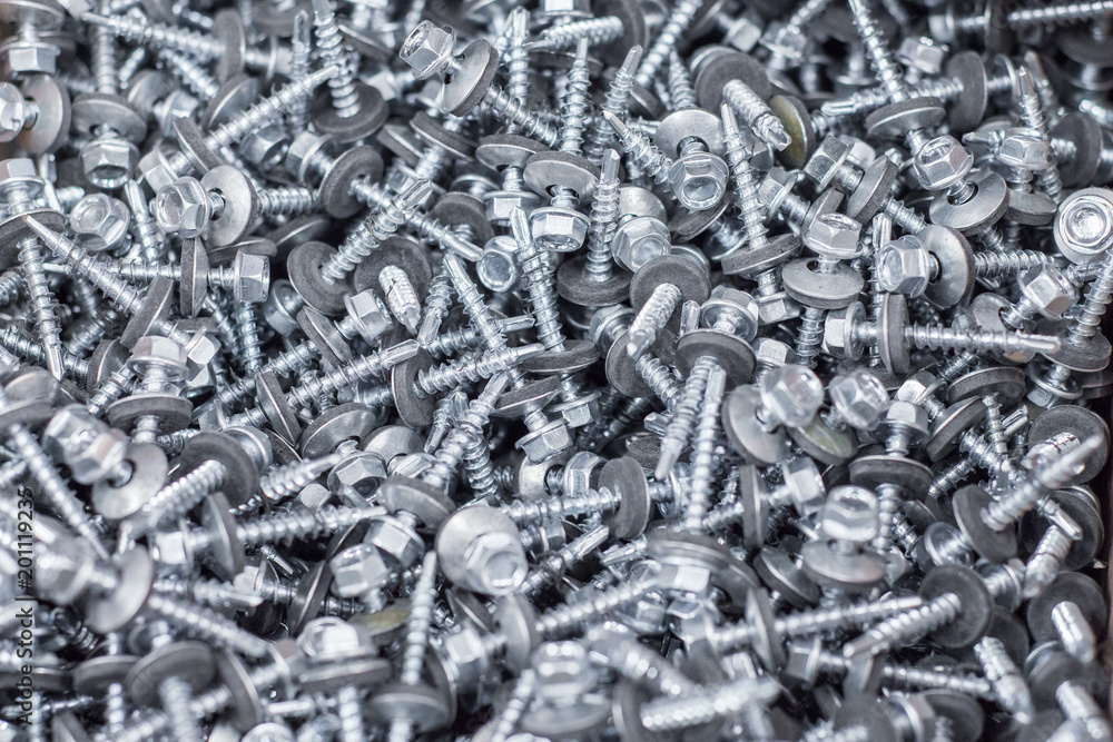 A huge pile of new metal screws.
A huge pile of new metal screws.