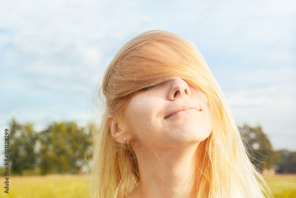 Blonde girl covered his eyes with his hair. Blonde girl covered his eyes with his hair.