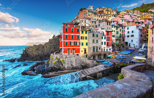 View on the colorful houses along the coastline of Cinque Terre area in Riomaggiore photo