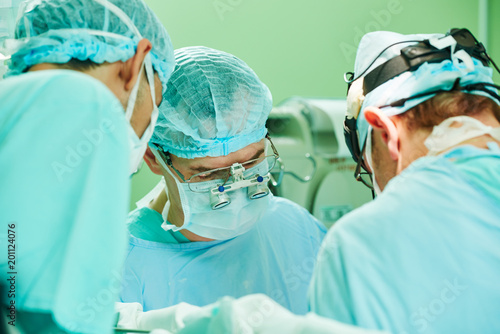 cardio surgery operating room. male cardiac surgeon in hospital photo